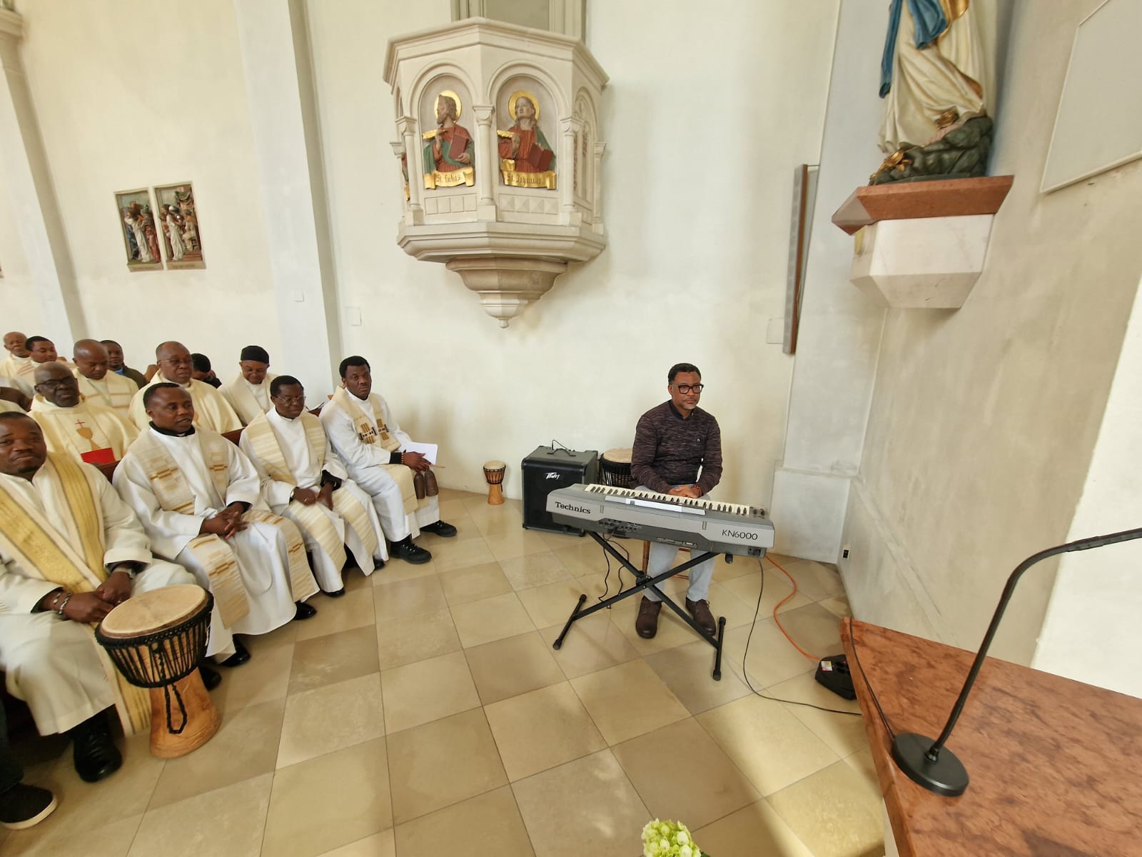 Priests and a keyboard player at the NIPRA Easter Tuesday meeting
